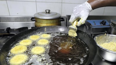 Sudanese-style falafel in sizzles in the pan.