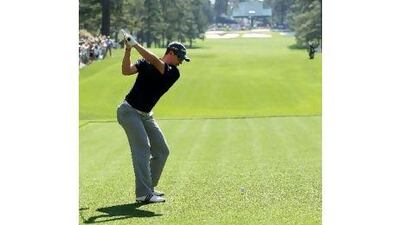 Justin Rose hits a shot during a practice round at Augusta National yesterday.