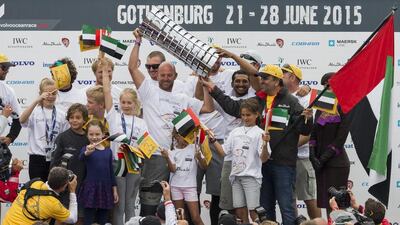 Abu Dhabi Ocean Racing lift the in-port victor's trophy after finishing atop the single-race sailing series that accompanied the nine-month Volvo Ocean Race. Carlo Borlenghi / Volvo Ocean Race