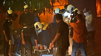 An injured person receives treatment after a fire at a restaurant in Mumbai on December 29, 2017. AP Photo