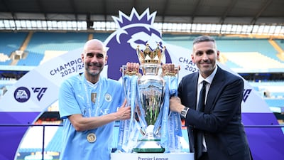 MANCHESTER, ENGLAND - MAY 19: Pep Guardiola, Manager of Manchester City and Khaldoon Al Mubarak, Chairman of Manchester City hold the Premier League title trophy following the team's victory in the Premier League match between Manchester City and West Ham United at Etihad Stadium on May 19, 2024 in Manchester, England. (Photo by Justin Setterfield / Getty Images)