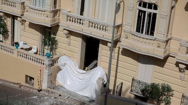 The damaged entrance of a residential building in Monaco after an explosive device was detonated. AFP