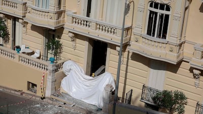 The damaged entrance of a residential building in Monaco after an explosive device was detonated. AFP