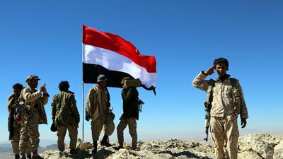 Yemeni fighters loyal to the Saudi-backed Yemeni government hold position during an offensive against Houthi rebels positions in the Nehem region east of the capital Sanaa. Soliman Al Nowab / EPA