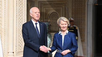 Tunisian President Kais Saied shakes hands with European Commission President Ursula von der Leyen at the presidential palace in Carthage. AP