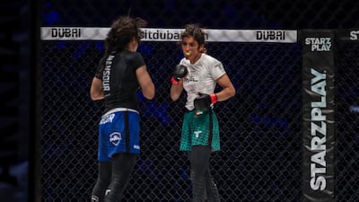 Zamzam Al Hammadi, right, goes on the attack against Egypt's Abeer Mansour.