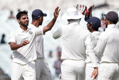 Bhuvneshwar Kumar, left, took two wickets for India on Day 3. Bikas Das / AP Photo