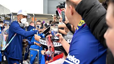 Pierre-Emerick Aubameyang signs autographs upon arriving at Sydney International Airport. AFP