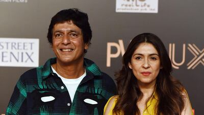 Bollywood actor Chunky Pandey, left, with his wife Bhavna Pandey attend the premiere of Hindi film 'Bharat' in Mumbai on June 4, 2019. AFP