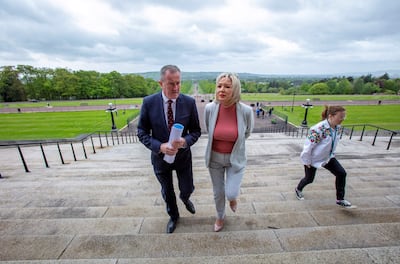 Northern Ireland's Deputy First Minister and Irish republican Sinn Fein party Northern Leader Michelle O'Neill and colleague Conor Murphy arrive at Parliament Buildings, the seat of the Northern Ireland Assembly, on the Stormont Estate in Belfast, Northern Ireland, on May 13, 2022. - Northern Ireland's Democratic Unionist Party (DUP) is set to block the restart of the province's new assembly when it meets on Friday as part of an ongoing protest against post-Brexit trade arrangements. The pro-UK DUP, which came second in last week's elections to the Stormont assembly, has said it will obstruct the selection of a speaker to the devolved legislature, effectively leaving it unable to function. (Photo by Paul Faith / AFP)