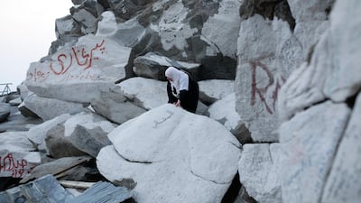 A Muslim woman tries to climb up Mount Al-Noor where the Prophet Mohammed received the first words of the Quran in Mecca, Saudi Arabia. Abir Abdullah