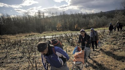 A migrant family from Afghanistan approaches Croatia’s border with Bosnia. Getty
