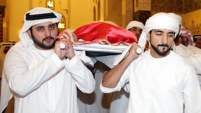 Sheikh Maktoum bin Mohammed, Deputy Ruler of Dubai, and Sheikh Hamdan bin Mohammed, Crown Prince of Dubai, carry the body of Sheikh Rashid bin Mohammed in Zabeel Mosque in Dubai. AFP Photo