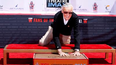 Stan Lee places his handprints in cement during a ceremony in the forecourt of the TCL Chinese theatre in Los Angeles, in 2017. Reuters