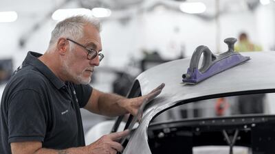 An employee works on one of the DB4 GT Zagato Continuation model. Courtesy Aston Martin