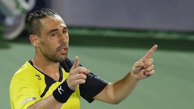 epa05182443 Marcos Baghdatis of Cyprus celebrates winning his semi final match against Feliciano Lopez of Spain during the Dubai Duty Free Tennis ATP Championships in Dubai, United Arab Emirates, 26 February 2016. EPA/ALI HAIDER