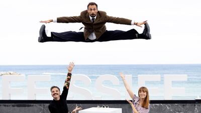 Spanish producers Elena Trape, right, and Javier Giner, left, pose with Spanish actor Oriol Pla during the presentation of the film 'Yo, adicto' at the 72nd edition of the San Sebastian International Film Festival in Spain. EPA