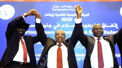 Omar Al Bashir with South Sudan's President Salva Kiir, left, South Sudanese rebel leader Riek Machar, right, after they agreed to a peace deal in Khartoum in June 2018. AFP