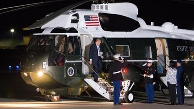 US President Donald Trump (C) walks off Marine One after arriving at Joint Base Andrews to greet three US detainees that were released by North Korea in Maryland. Michael Reynolds / EPA