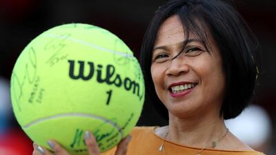A fan shows the autographs she has accumulated at the Mubadala World Tennis Championship. Chris Whiteoak / The National