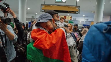 Released Gaza flotilla activists arrive at JFK International Airport in New York City. The Israeli government deported hundreds of activists who attempted to deliver aid to Gaza. EPA