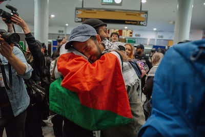 Supporters greet Gaza flotilla activists as they arrive at JFK International Airport in New York after being released by Israel, in May. EPA
