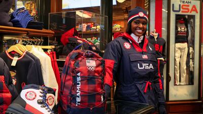 US Winter Olympic bobsledder Aja Evans shows off items designed for the US Winter Olympic Team at the company's store in New York City. Reuters