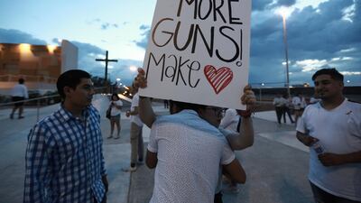 People gather in Juarez, Mexico, in a vigil for the 3 Mexican nationals who were killed in the El Paso shopping-complex shooting. AP Photo