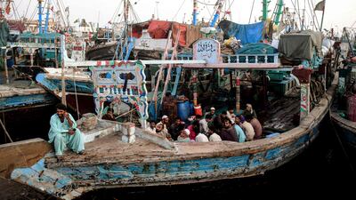 Fishermen break their fast on a boat in the port city of Karachi. AFP