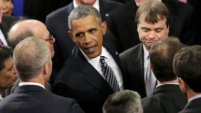 President Barack Obama greets guests after giving his State of the Union address before a joint session of Congress on Capitol Hill in Washington DC. J Scott Applewhite / AP Photo