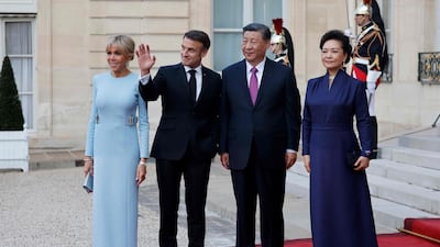 Mr Macron, Ms Macron, Mr Xi and Ms Peng at the steps of the Elysee Palace. AFP