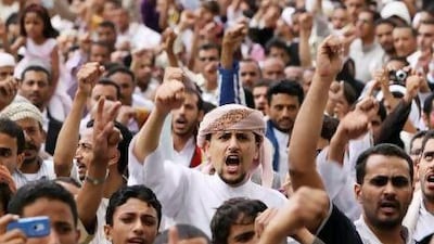 Anti-government protesters chant slogans during a demonstration outside the home of Yemeni president Abd-Rabbu Mansour Hadi, demanding the dismissal of the rest of former president Ali Abdullah Saleh's family members from senior army and police positions.