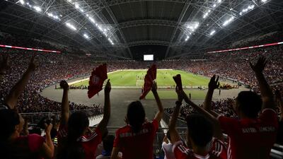 Fans celebrate a Bayern Munich goal. Suhaimi Abdullah / Getty Images