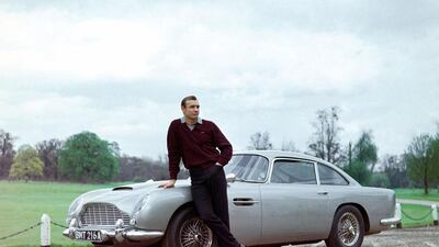 Sean Connery with one of the two Aston Martin DB5 cars used in the filming of 'Goldfinger'. Rex