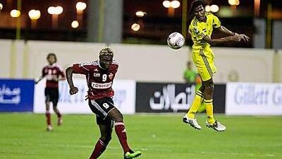 Kalba's Rashid Malullah heads the ball during the 2-2 draw with Al Ahli last night.