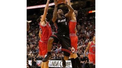 LeBron James makes a drive to the basket against the Chicago Bulls earlier this month. Mike Ehrmann / Getty Images