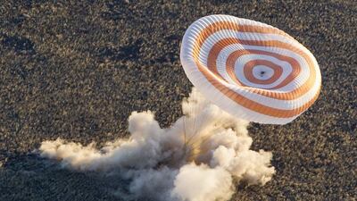 The Soyuz TMA-09M capsule carrying the International Space Station (ISS) crew lands in a remote area near the town of Zhezkazgan in central Kazakhstan. A Soyuz capsule carried an International Space Station crew of three back to Earth on Monday along with an Olympic torch that was displayed in open space as part of Russia’s preparations for the Sochi 2014 Winter Games. Shamil Zhumatov / Reuters