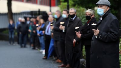 Mourners waiting for the funeral procession of John Hume gather outside St Eugene's Cathedral. Reuters