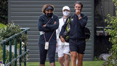 Serena Williams and coach Patrick Mouratoglou arrive for a practice session at the All England Club, ahead of the Wimbledon Grand Slam. AFP