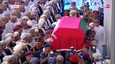The coffin is carried to the Grand Mosque. Oman TV via AP