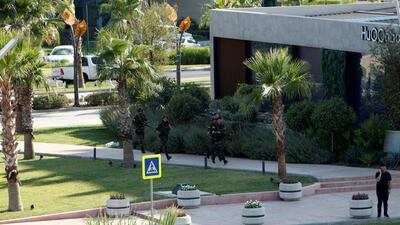 Kurdish security members are seen near a restaurant where Turkish diplomats and Turkish consulate employee were killed in Erbil, Iraq July 17, 2019. Reuters