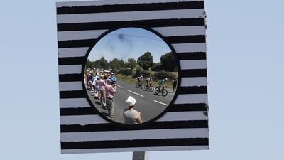 Spectators watch, left to right, Quick-Step Alpha Vinyl Team's Mikkel Honore, Nils Politt of Bora Hansgrohe and Jumbo Visma's Wout Van Aert during Stage 15. EPA