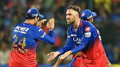 Royal Challengers Bengaluru's players celebrate after the dismissal of Chennai Super Kings' Rachin Ravindra, who was run out on 61 by Swapnil Singh. AFP