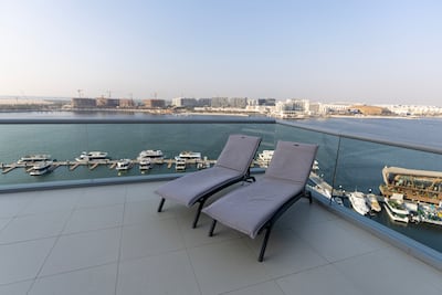 The spacious terrace with a spectacular waterfront view is a winner for the family. Chris Whiteoak / The National