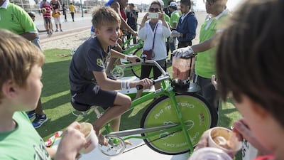 Marko Polyak enjoys the smoothie challenge – while his friends enjoy the fruits of their labour. Antonie Robertson / The National