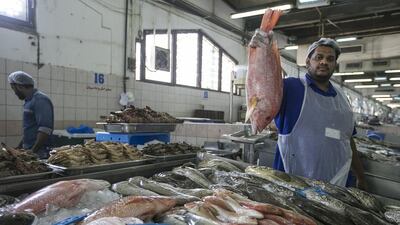 Indian trader Asif Kappil at the Mina Fish Market in Abu Dhabi. Mona Al Marzooqi / The National