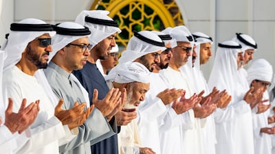 Sheikh Mohamed, Sheikh Mansour, Sheikh Saif, Sheikh Nahyan bin Zayed, Sheikh Abdullah bin Bayyah and Dr Omar Al Darei pray at the grave of Sheikh Zayed