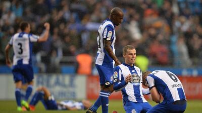 Alex Bergantinos, second right, and Raul Albentosa of Deportivo La Coruna celebrate. Octavio Passos / Getty Images