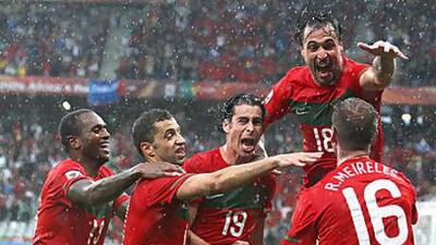 Portugal celebrate opening the scoring against North Korea. They went on to celebrate another six goals.