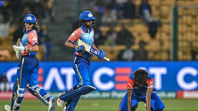 Mumbai Indians' captain Harmanpreet Kaur, centre, and teammate Amelia Kerr take a run. AFP